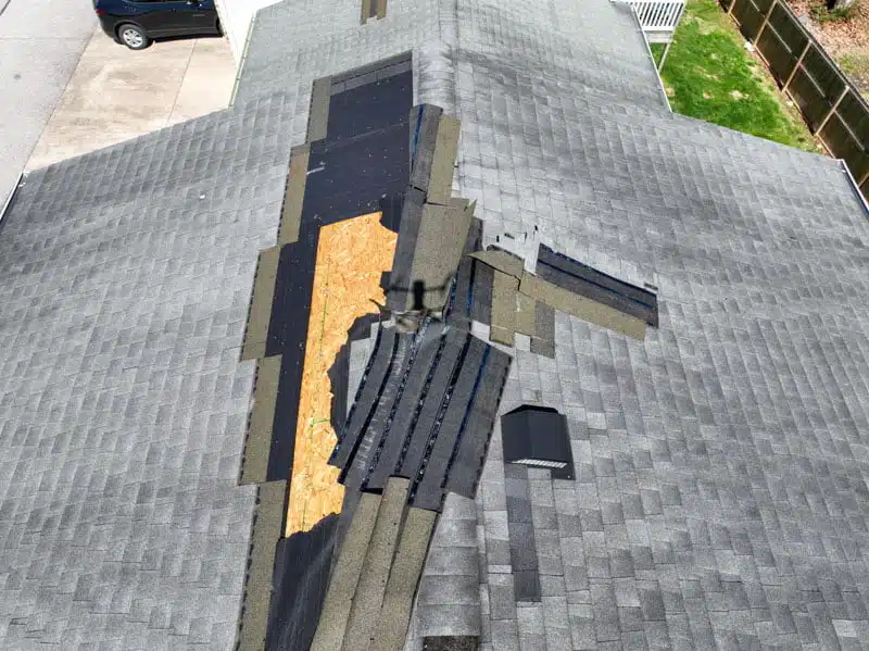 Drone view of a damaged roof from a storm during Roof Inspections