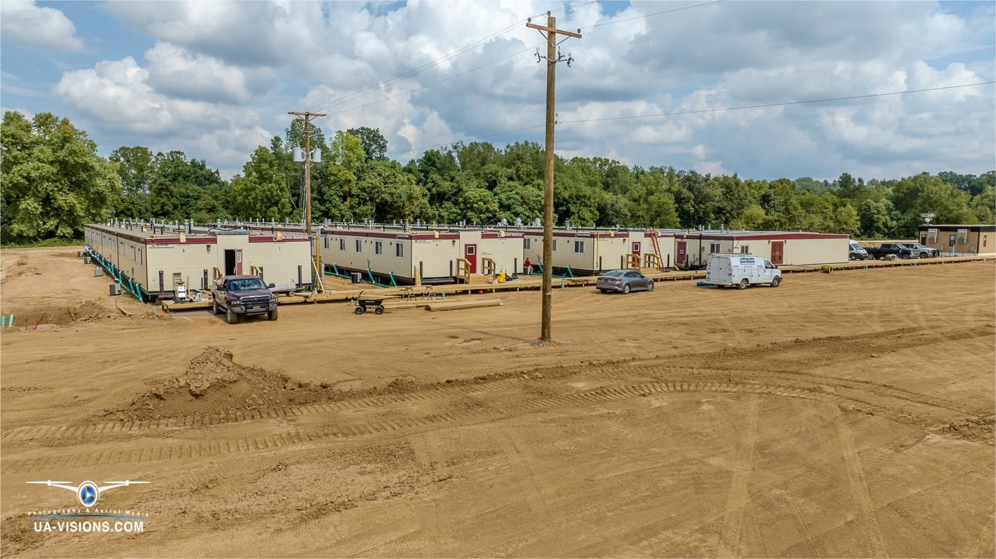 Overlooking the order of operations, UA-Visions' lens zooms in on SDRS's well-planned worker lodgings amidst Ashton's development dance.