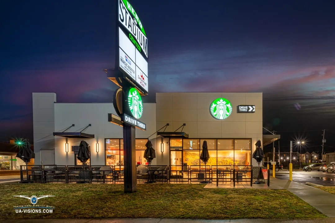 Our Portfolio of Digital Creations Starbucks exterior in Huntington at dusk with its signs and windows illuminated