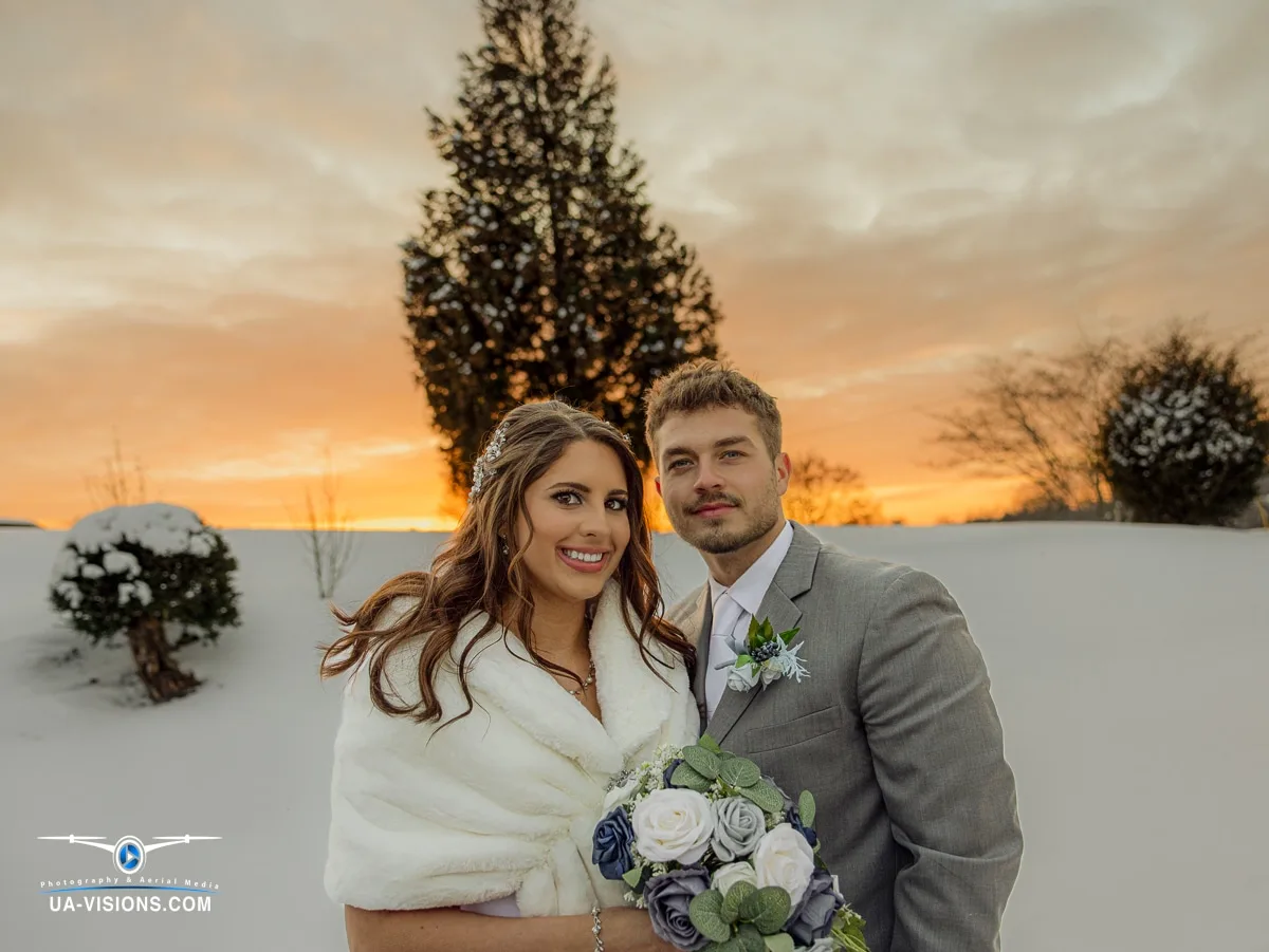 Our Portfolio of Digital Creations Katilyn and Logan Gaddy smiling together outdoors on their wedding day