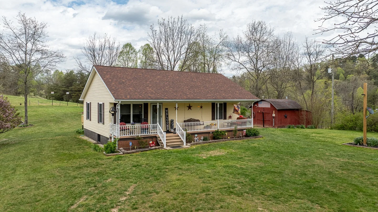 Professional Photography, Videography & Drone Services – Charleston WV Aerial view of the home and wooded property in Liberty, West Virginia