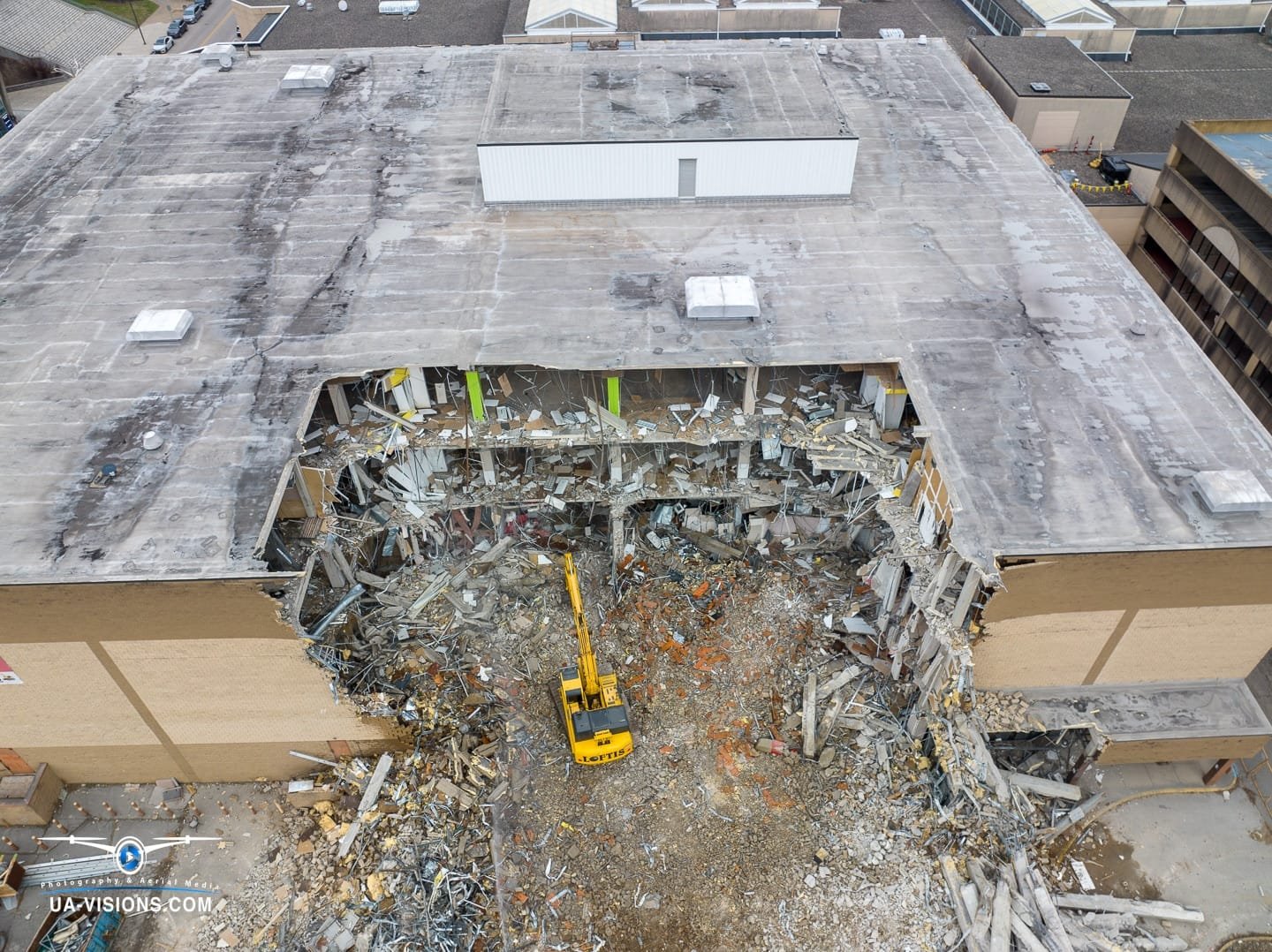 Aerial view of a demolition progression project of the Sears building at the Charleston Town Center Mall captured by UA-Visions