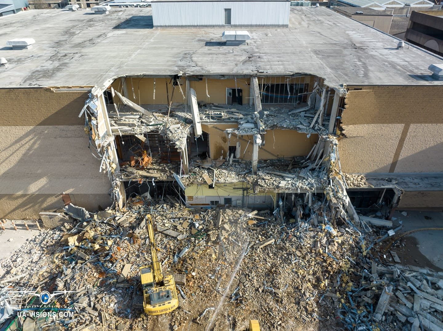 Aerial view of a demolition progression project of the Sears building at the Charleston Town Center Mall captured by UA-Visions