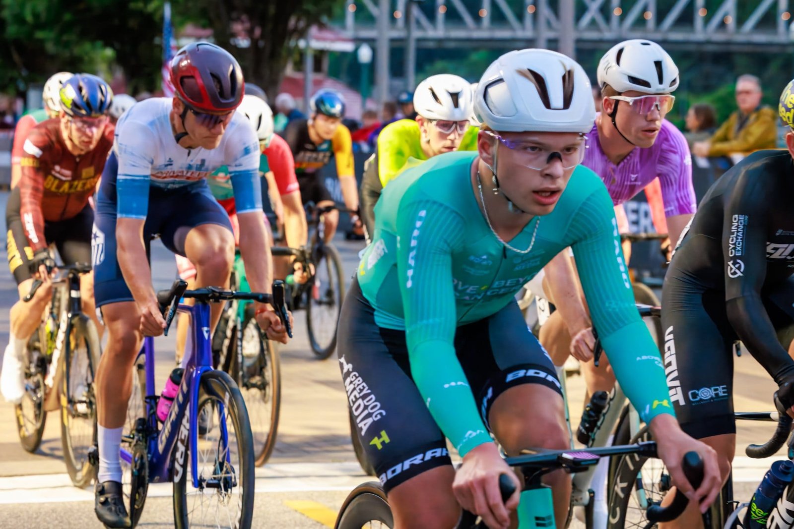 USA Cycling 2025 Photography and Video Close view of a pack of cyclists racing past downtown spectators